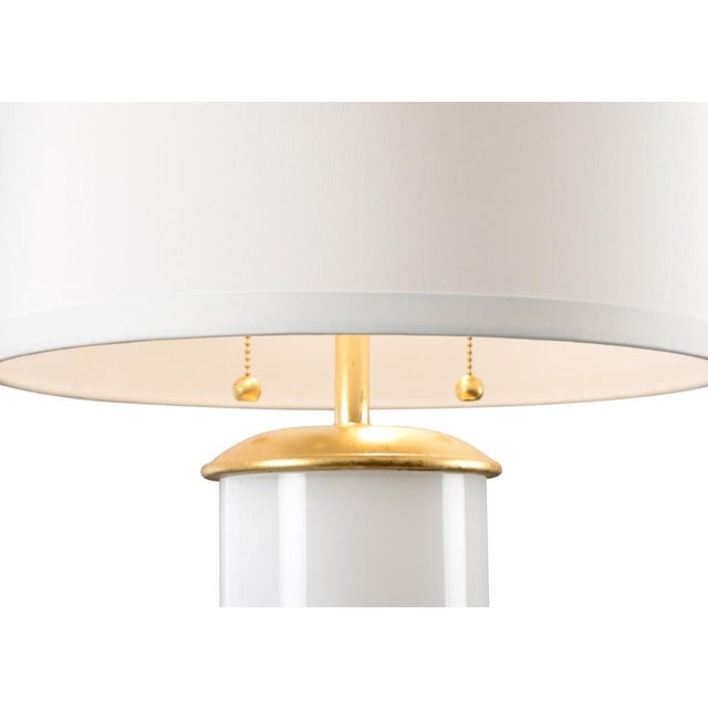 Brighten your home with this charming transitional table lamp. Savannah features a colorful glass cylinder with a dazzling...