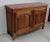 Sideboard in the Transitional style, in Walnut, except for the two back legs which are in Cherry. Two boards make up its...