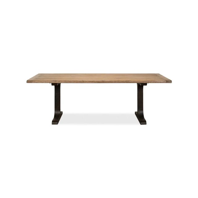 With a reclaimed pine top with breadboard ends, raised on a trestle form iron base. The reclaimed pine table top is...