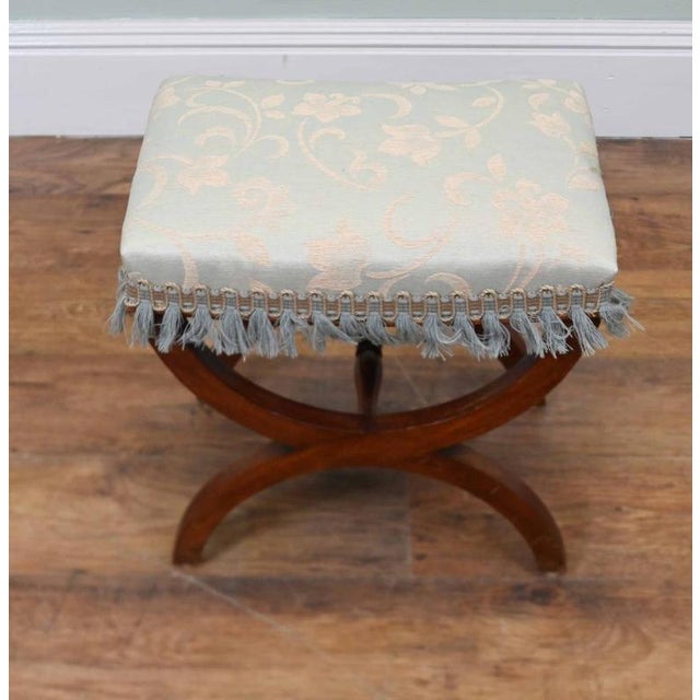 WElegant Regency style mahogany stool dating from the late 19th century The upholstered rectangular seat is finished in...