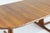 Vintage Danish round extendable dining table from the 1960s made of solid teak wood. This Danish dining table can be...
