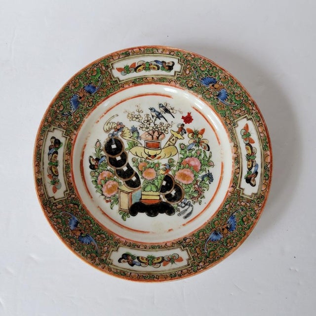 An unusual early 20th-century Chinese export famille rose porcelain plate, centered with a symbolic still-life depicting a...