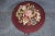 Adjustable carved Walnut stool with floral needlepoint upholstery.
