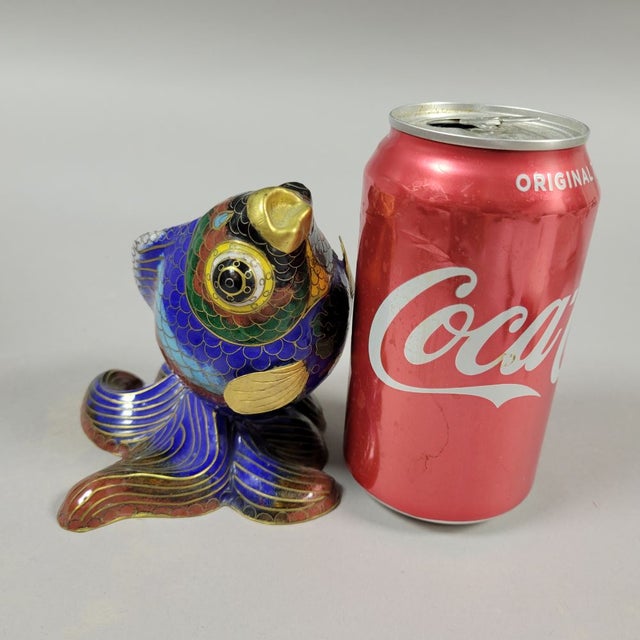 Vintage Chinese cloisonne fish with gold gilt. In the shape of a Japanese pearl coy, it is a lovely piece and quite...