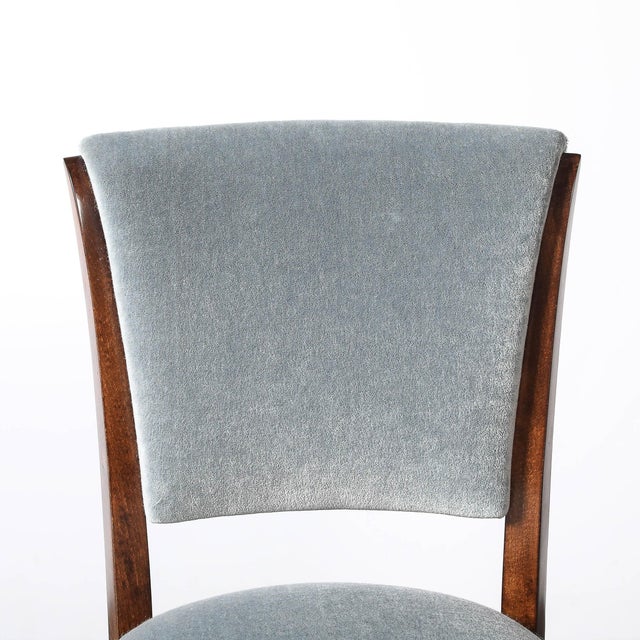 This exquisite set of eight dining chairs embodies the refined elegance of French Art Deco design, with a harmonious...