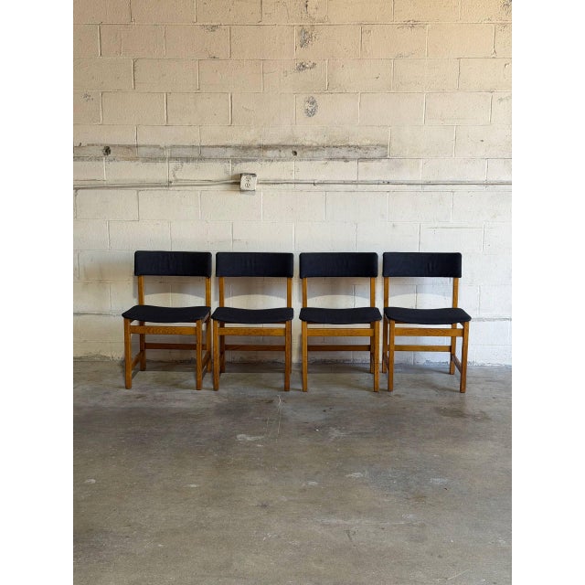 This set of four dining chairs features clean Scandinavian lines and an organic frame. Vintage Danish Mid-Century Modern...