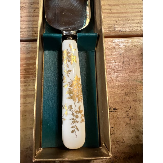 Upscale your entertainment with this pie / cake server. Ceramic handle with gold floral design. Marked Staffordshire....