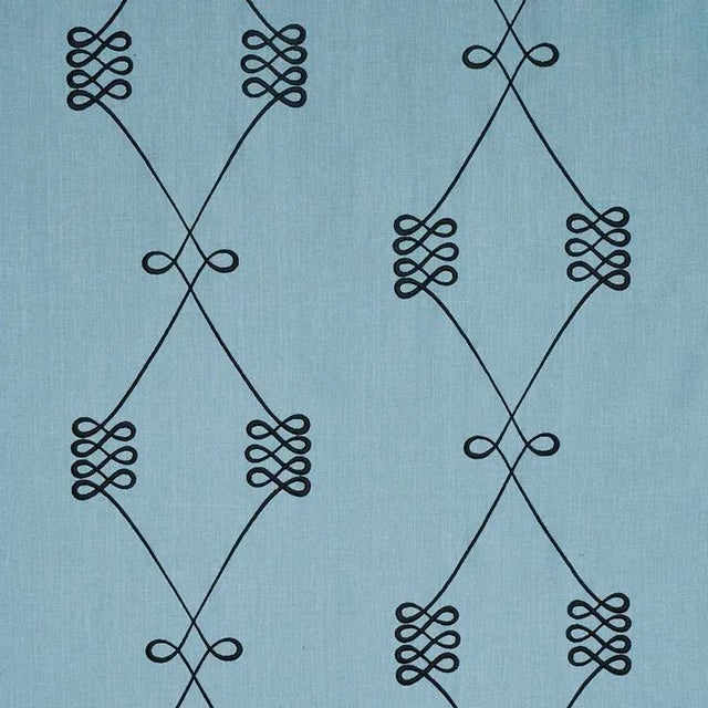 A swirling interpretation of a classic trellis motif, this stylized pattern boasts a nice scale and a sophisticated...