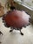 Masterfully carved mahogany tea table. Dining height.