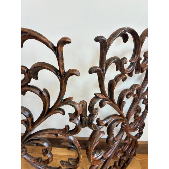 Stunning vintage three-panel cast iron fireplace screen featuring intricate scroll, leaf, and floral motifs. Provides both...