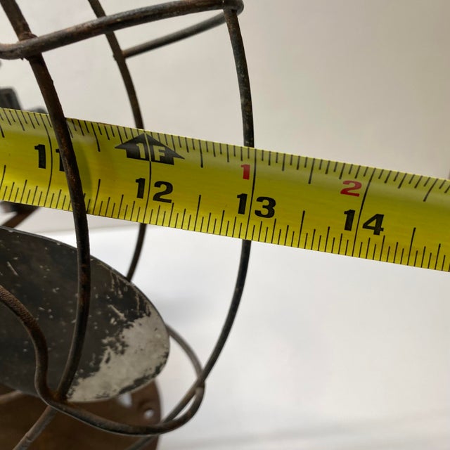 *16 inches tall; 13 inches wide; base 6.25" diameter. *Rusty and does not operate; cord was cut. *Cage rotates side to...