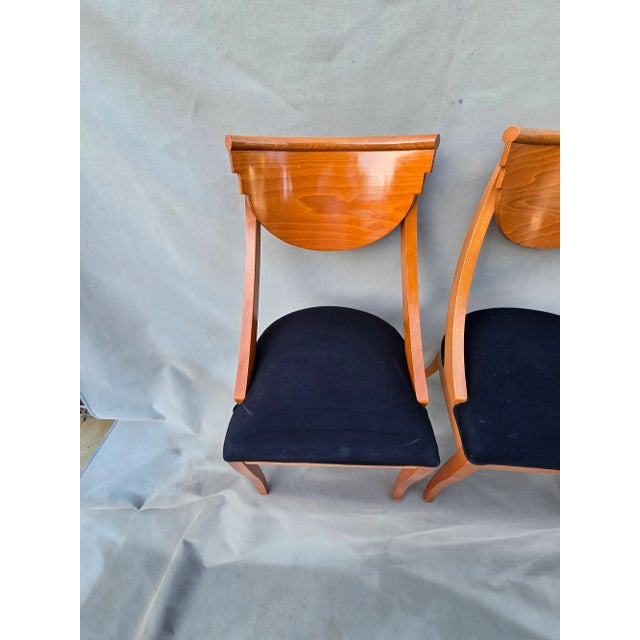 A set of two exquisite dining chairs in the Deco style. These would be a great addition to a dining room or even flanking...