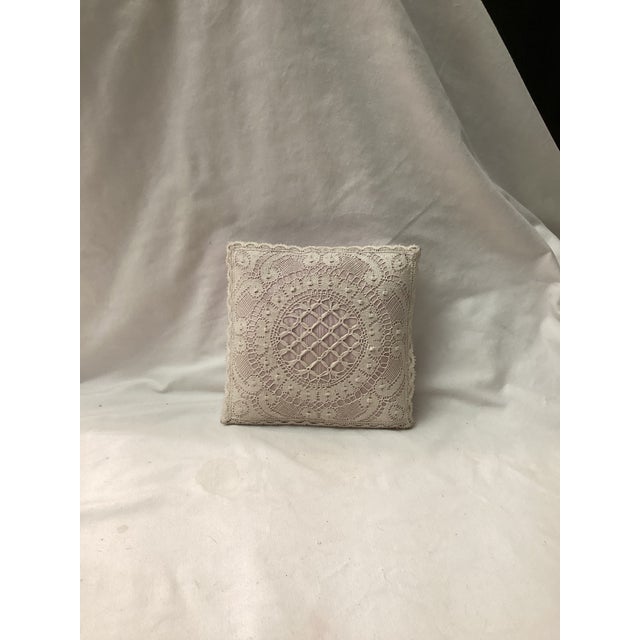 A romantic vintage BOUDOIR pillow, also known as a keepsake pillow, featuring intricate Bobbin lace detailing over pink...