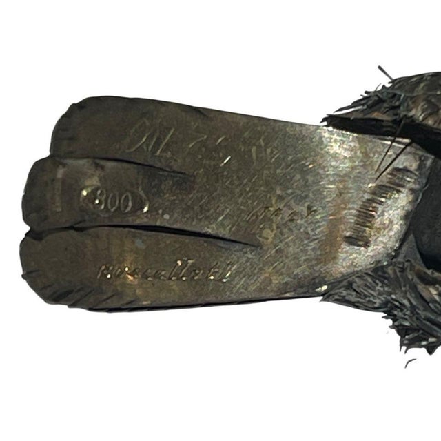 A finely crafted pair of sterling silver sparrow figures by Buccellati, masterfully executed in the firm’s signature...