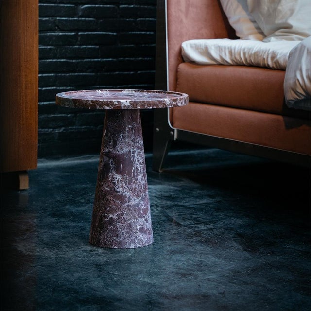 Introduce monumental elegance and a grounded detail to your interior with the stunning Rosso marble CONE side table. The...