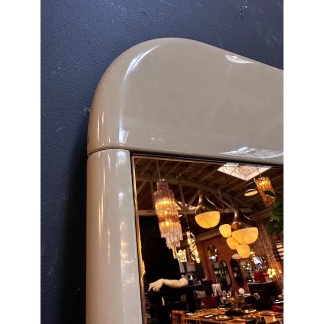The Mid Century Italian Smoked Wall Mirror from the 1980s features a sleek smoked glass design, embodying the style of the...