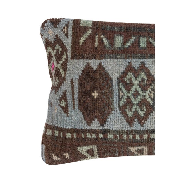 Add a touch of history and warmth to your space with this vintage handmade Turkish wool rug cushion cover. Crafted from...