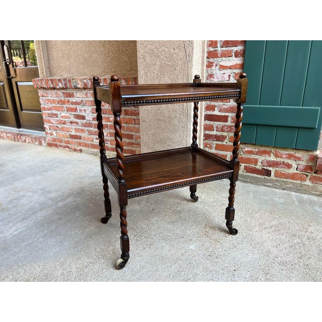 Antique English Barley Twist Tea Trolley Bar Cart Table Tiger Oak Dumbwaiter. Direct from England, a beautiful antique...