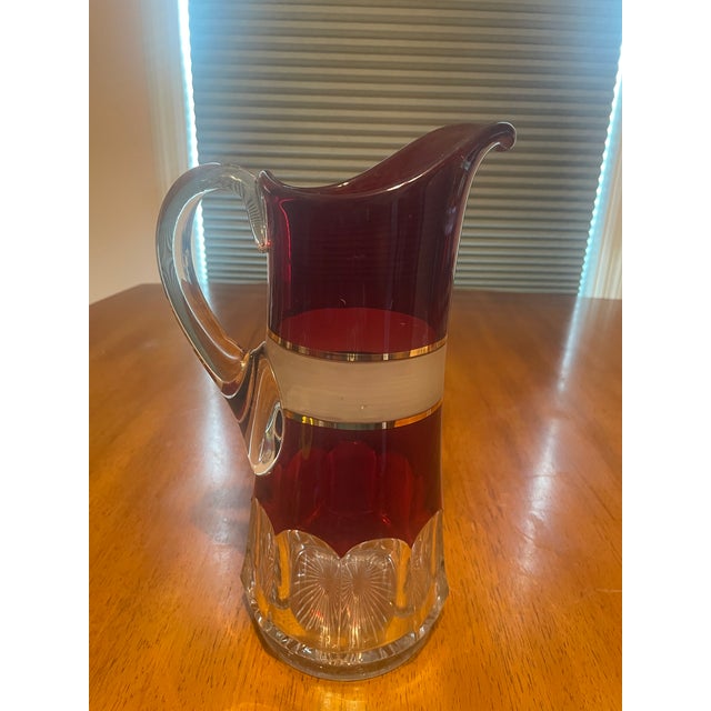 Add striking retro glamour to your entertaining with this complete vintage ruby red glass beverage set. The set includes...
