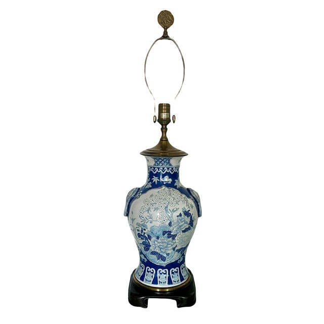 Impressive 1950's Chinese blue and white table lamp on a very nice hand carved Ming style solid wood stand. The enamel...