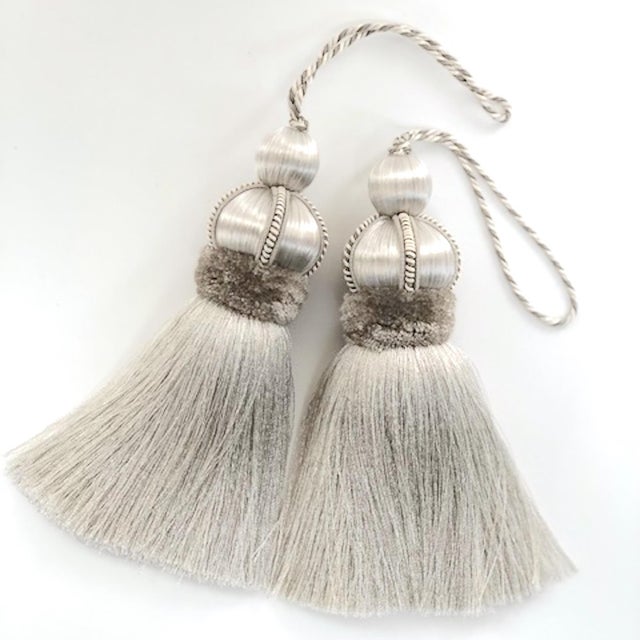Pair of silver/gray colored key tassels with hand cut velvet ruche, decorative gimp and twisted cord detail. **Please...
