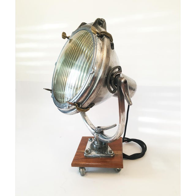 Vintage nautical or industrial ship spotlight by Crouse Hinds, mounted on wood base, circa 1930. For display purposes...