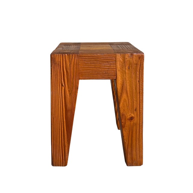 This hand-crafted stool features a robust, primitive design that emphasizes the raw, organic beauty of solid timber....