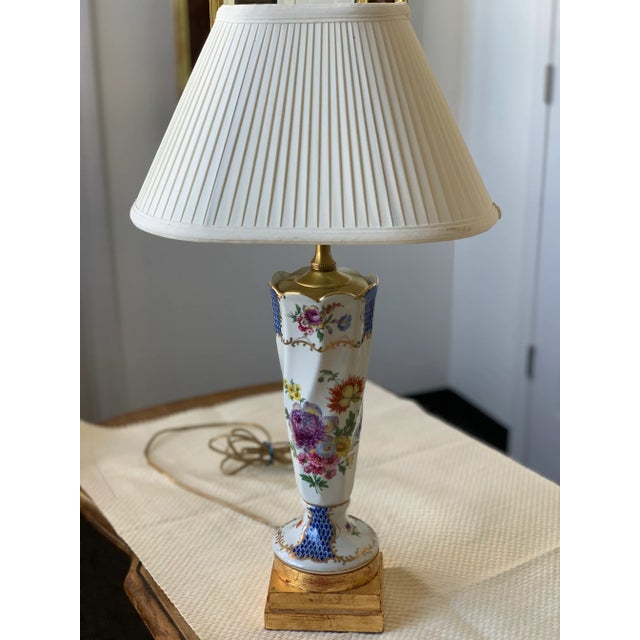 2 Hand Painted Porcelain Herrand Style Lamps with fish tale pattern and floral design. Gold Guilded Bases. These lamps are...