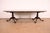 An exceptional antique Georgian or Chippendale style double pedestal extension dining table In the manner of Baker...