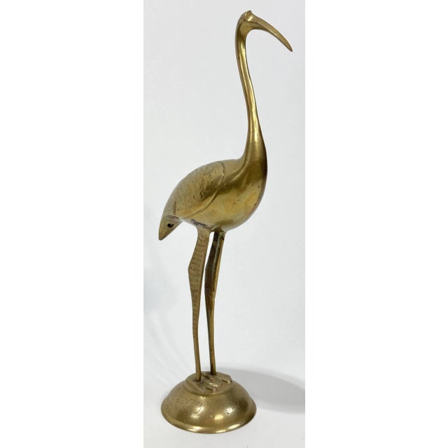 The bird's the word! Vintage brass shorebird atop a round platform with etched detail throughout. Nice clean lines. Pretty...