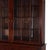 Presenting an exceptional antique Sheraton style step-back display cabinet, meticulously crafted from rich flame mahogany...