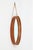Rare wall mirror by Glas Mäster, Markaryd, Sweden, 1960s/1970s. Model 103, medium size. Teak veneer and suede with brass...
