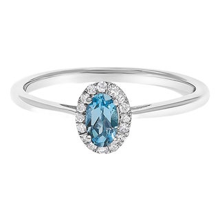 10K White Gold 5X3MM Oval Blue Topaz and Diamond Accent Halo Ring (I-J Color, I1-I2 Clarity) - Ring Size 7.5 For Sale