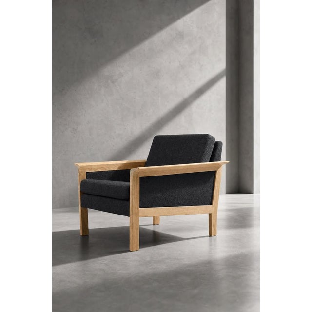 This pair of lounge chairs was made in Denmark during the 1960s. The wide and comfortable armchairs reflect the...