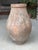 Hand-thrown antique terracotta storage jar of classic Mediterranean form. This substantial vessel features a graceful...