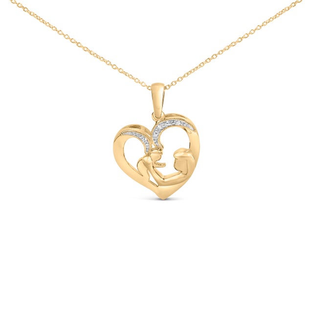 A luminous tribute to the bond that begins at a heartbeat and lasts a lifetime, this pendant sketches an open heart where...