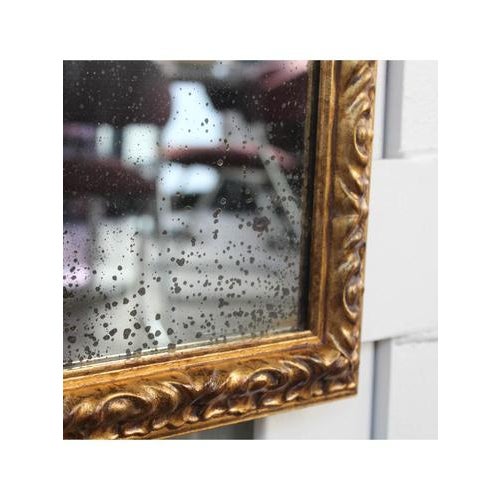 Gilded mirror Date: 1980 Origin: Italy Model: Carved frame Materials: Wood, mirror Width: 31 cm Depth: 3 cm Height: 38 cm