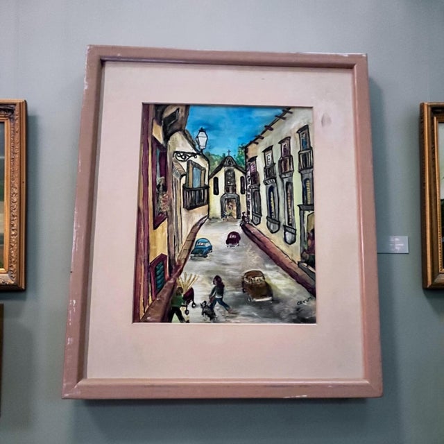 An original 1973 oil on board by Cervi (Columbia Rossi) depicting a charming French Basque village street leading toward a...