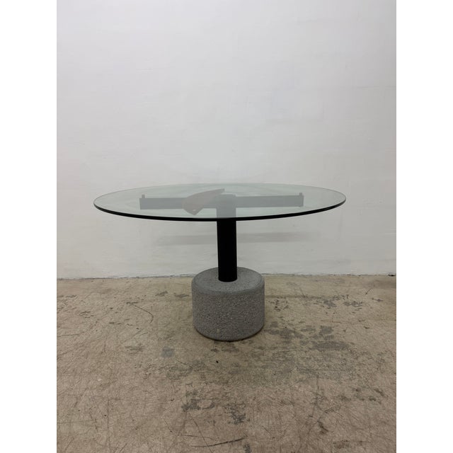Round glass top dining or center table with concrete base and postmodern designed steel supports by Giovanni Offredi for...