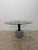 Round glass top dining or center table with concrete base and postmodern designed steel supports by Giovanni Offredi for...