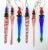 Set of six large vintage handblown glass icicle ornaments featuring elongated clear and jewel-tone glass bodies with bold...