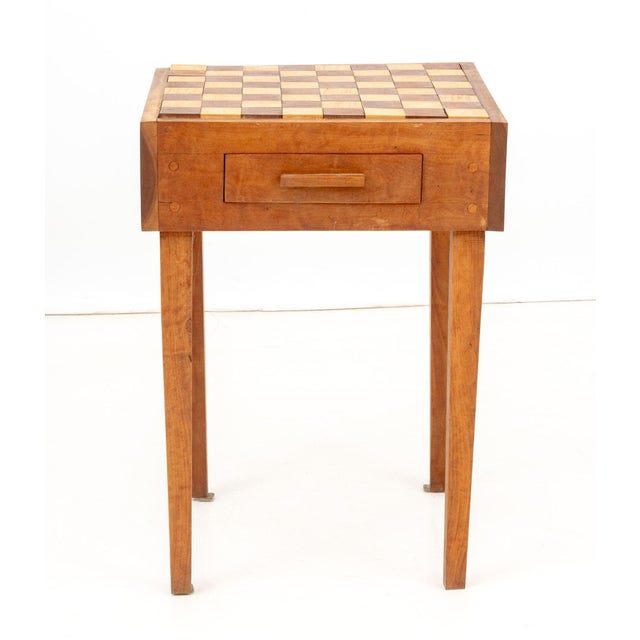 Contemproary Carved Wood Chess Table and Chessmen, the chess board top above two drawers. 25.75" H x 18" W x 18" D....