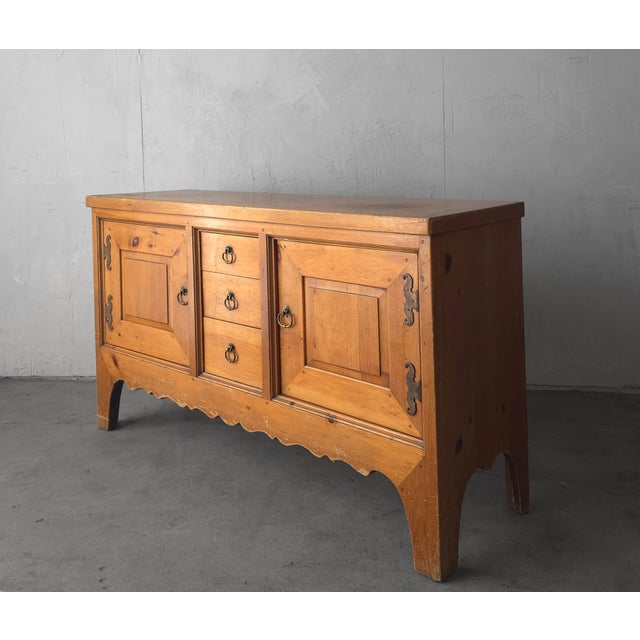 Beautiful handcrafted 1950's pine buffet oozes warmth and comfort. The hand carved trim details and beautiful patinaed...