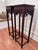 This vintage pair of monumental size Asian solid rosewood plant stands/pedestals feature traditional Ming-style aesthetics...