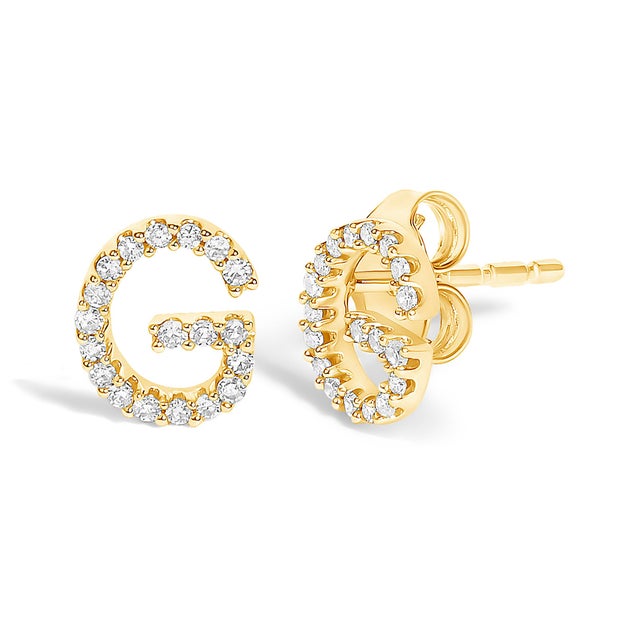 Expertly crafted to symbolize individuality and grace, this exquisite "G" initial stud earring is fashioned from radiant...