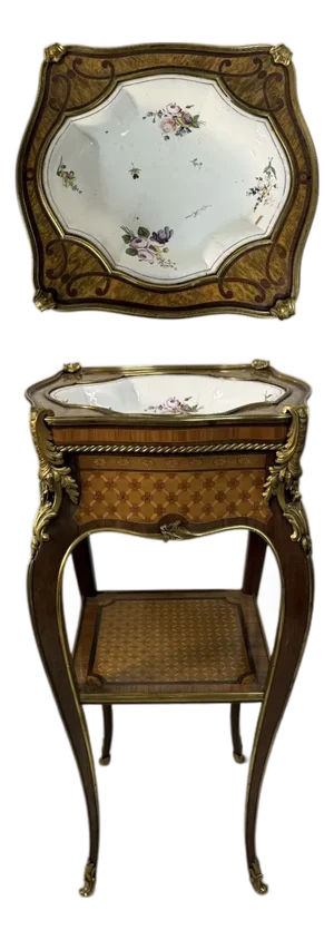 An Ormolu & Sevres Porcelain Mounted Table by Henry Dasson