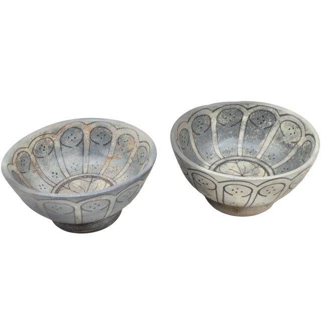 Set of two antique handcrafted and glazed Moroccan ceramic bowls. Featuring an elaborate hand-painted fine Arabesque...