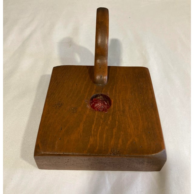 Antique hand carved candle stick. There is some wax residue in the holder.