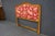French country style queen headboard crafted in cherry with a shaped crest rail and carved floral ornament at the center....