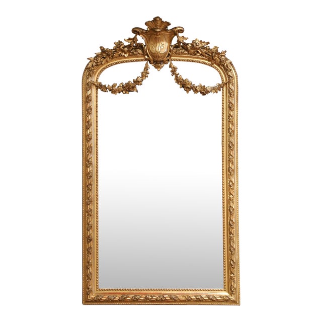 19th Century French Louis XVI Giltwood Mirror With Shield Crest and Floral Decor For Sale